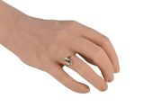 an image of a woman ' s hand with a ring on it