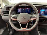the interior of a car with a steering wheel and dashboard controls