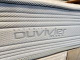 close up of the logo on the bottom of a mattress