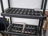 a shelf that has a bunch of tools on it