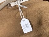 a brown teddy bear with a tag on it ' s neck
