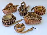 a lot of different types of leather items on the table