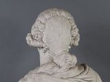 a statue of a woman with a hat on her head