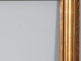 an antique gold frame with a white background