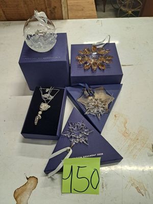 a lot of jewelry sitting on a table with a price tag on it