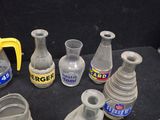 many vases that are sitting on a black table