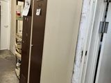 an image of a locker in a room with a door open