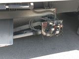 a close up of a truck ' s engine on the ground
