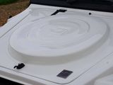 a close up of a white jeep with its hood up