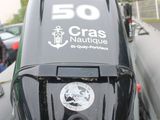 an image of a motor boat parked in a parking lot