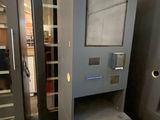 two metal filing cabinets in a room with a sign on the wall