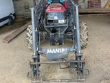 a tractor that is parked in a garage