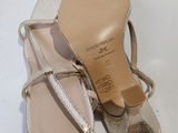 pair of women ' s shoes on a white surface with a white background