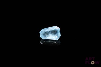 an image of a large blue diamond on a black surface