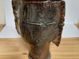 a vase that is sitting on a wooden table