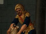 an old painting of a man washing a horse in a stable