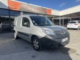 a silver van parked in front of a building
