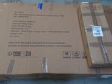 a cardboard box that is sitting on the ground