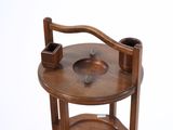 a small wooden table with a bowl on it