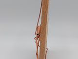 a small piece of wood with a piece of wire attached to it