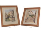 pair of watercolor paintings of a street scene in a wooden frame