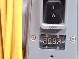 a close up of an electrical meter with a bunch of yellow wires