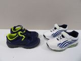two pairs of tennis shoes are on a white surface