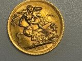 an image of a gold coin with a horse and rider on it