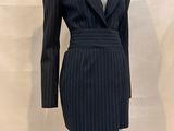 an image of a mannequin wearing a pinstripe suit