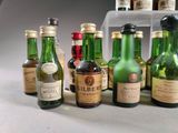 many bottles of alcohol lined up on a table