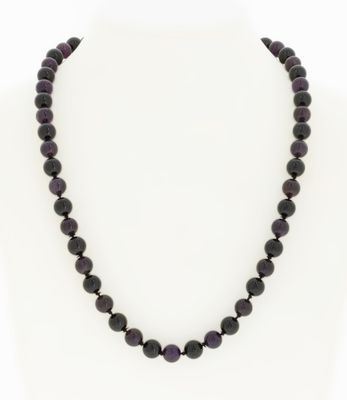 a black beaded necklace on a mannequin mannequin mannequin mannequin mannequin mannequin mannequin mannequin mann