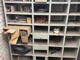 a shelf with a bunch of wires on it in a room