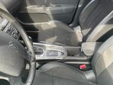 dashboard of a car with a steering wheel and dashboard controls