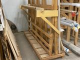 many pallets of wood sitting in a room