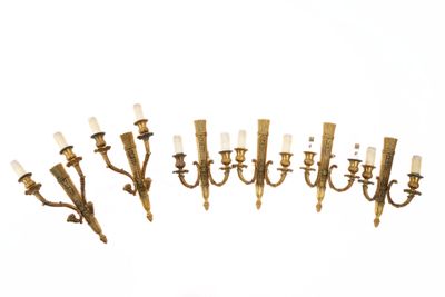 une photo d'un ensemble de six appliques murales en laiton