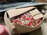 a cardboard box filled with assorted items on the floor