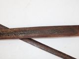 two old rusty wrenets on a white surface