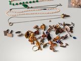 many different types of jewelry on display on the table