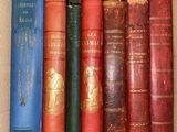 a box full of old books on a shelf