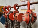 a bunch of chains hanging on the wall next to a fire hydrant