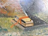 une peinture représentant un livre orné d'un ruban rouge