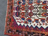 rug on the ground with a cat laying on top of it