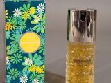 a bottle of perfume sitting next to a box of perfume