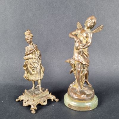 paire de figurines anciennes en bronze représentant une femme et un homme