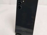 the back of a black phone with a camera attached to the back of it