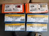several boxes of various types of band saws are stacked on top of each other