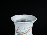 a white vase with a colorful design on it
