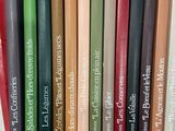 a lot of books that are sitting on a shelf