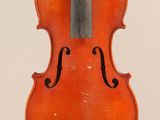 an old violin with a bow hanging from it ' s back