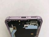 the back of a cell phone with a broken battery cover